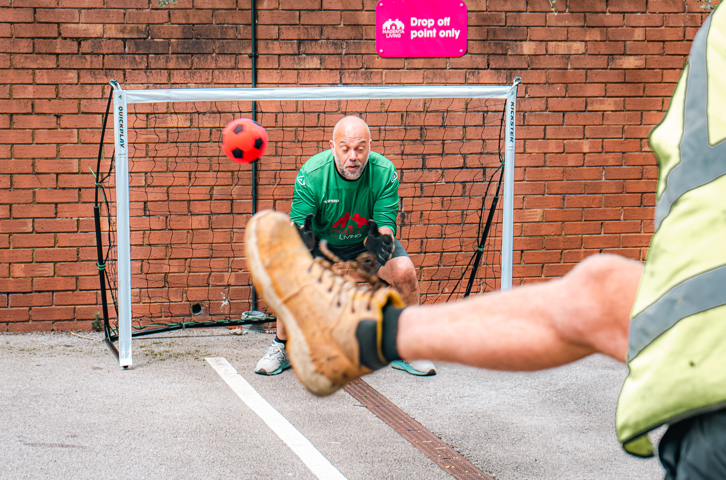 The goalkeeper attempts to save a shot during the ‘Beat the Keeper’ challenge at Magenta Living’s World Cup fundraising event.