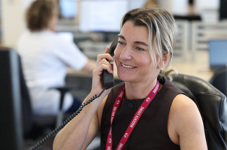 Magenta Living colleague speaking to a customer.