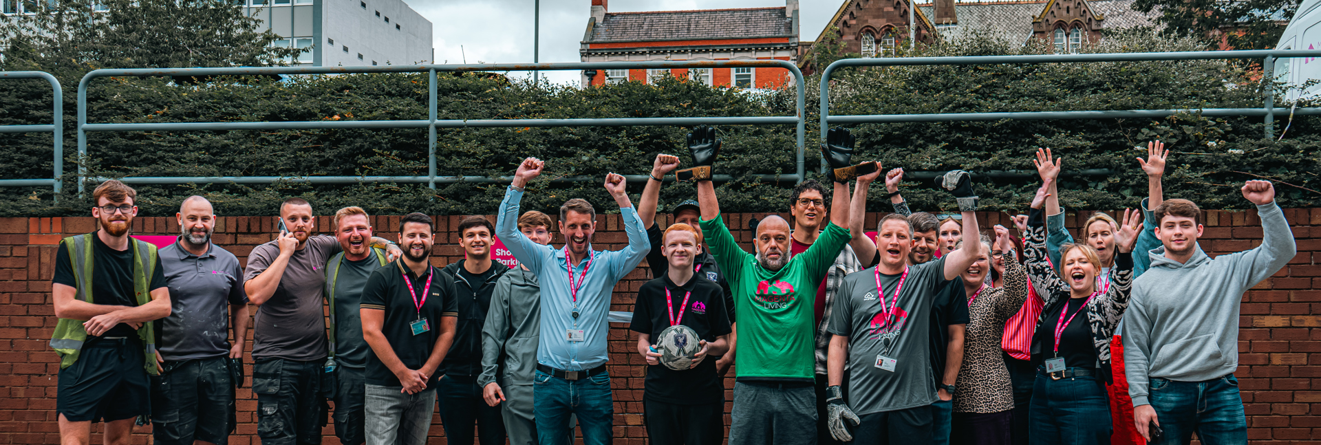 Colleagues taking part in the 'Beat the Keeper' challenge at Magenta Living's World Cup fundraising event, gathered together after the activity.